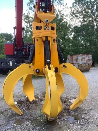 Used Grapple standing in yard